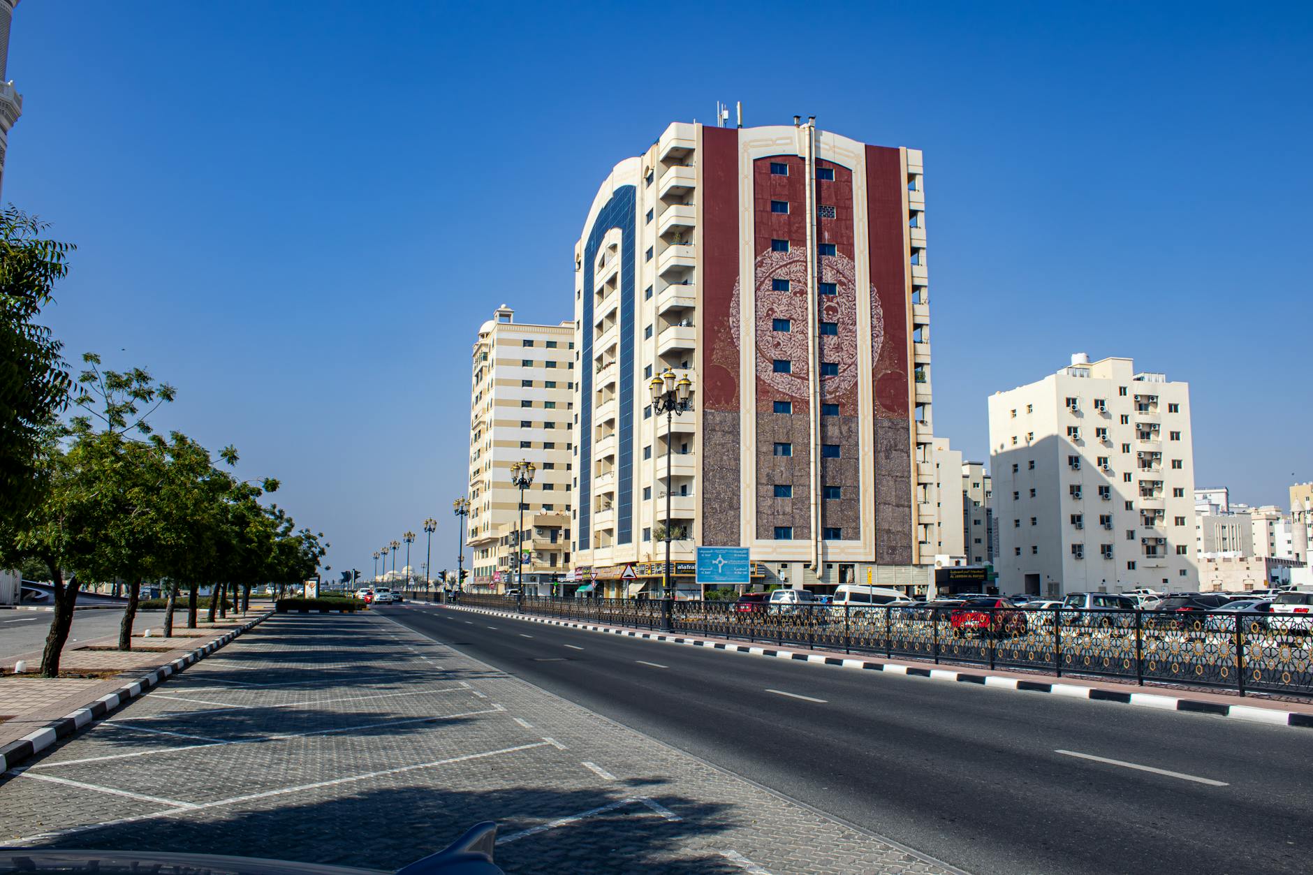 Vibrant cityscape of Sharjah featuring modern architecture and clear blue skies.