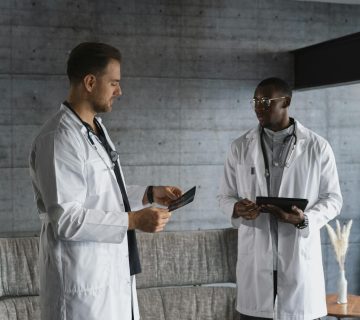 Two doctors in a medical office discussing an x-ray, emphasizing teamwork and healthcare expertise.